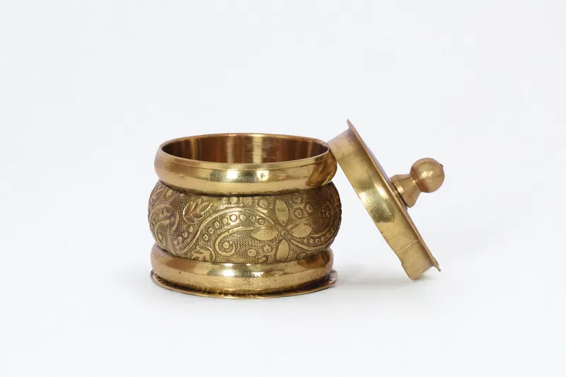 2. Brass Kumkum Holder – Symbol of Auspiciousness
